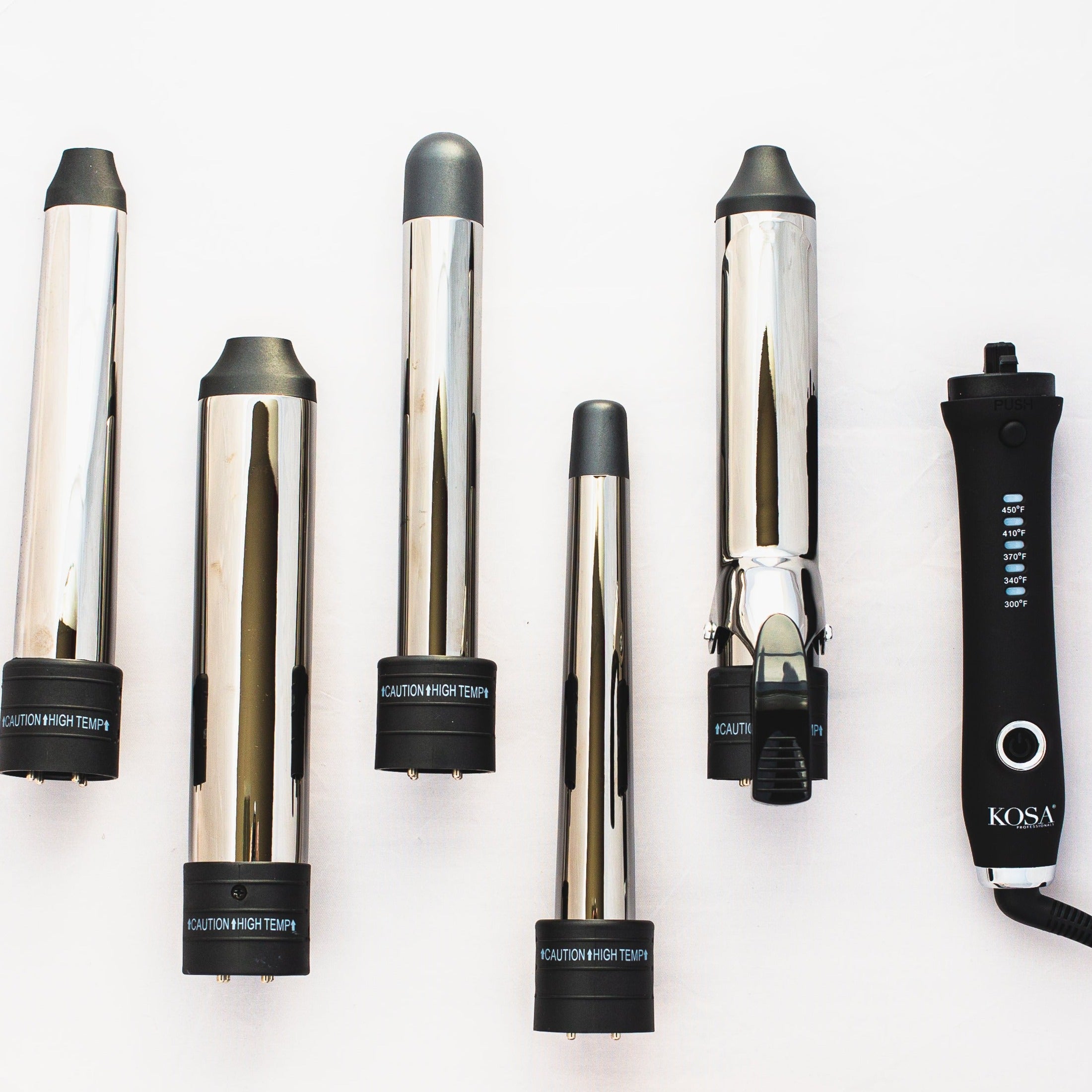 Curling iron with outlet interchangeable barrels